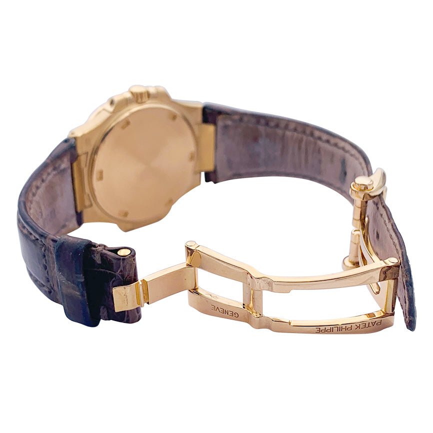 Montre Patek Philippe, "Nautilus", or rose, diamants, cuir. - Castafiore